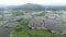 A skyline aerial view of fish pong under smokey Hong Kong next to Shenzhen China