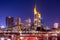 Skyline cityscape of Frankfurt, Germany during twilight evening with a bridge. Frankfurt Main in a financial capital of Europe