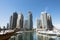 Skyline of Dubai Marina with apartment buildings, hotels and office skyscrapers under the clear blue sky, Middle East attraction