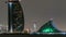 Skyline of Dubai at night timelapse with Burj al Arab in foreground in Dubai, United Arab Emirates