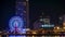 Skyline and Ferris wheel at Kobe Port Tower lighten up at Night.