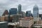 Skyline filled with old and new buildings, stormy skies overhead, Austin, Texas, 2018