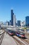 Skyline with METRA commuter rail trains public transport near Union Station portrait format in Chicago, United States