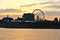 A skyline of Montreal Old Port at sunset. Foreground is Saint Laurent river