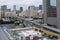 Skyline of New Orleans with Men Working on Top of Building and Interstate 10