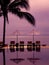 Skyline swimming pool at the ocean, sun loungers and sun umbrellas