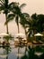 Skyline swimming pool, sun loungers next to the garden at the ocean