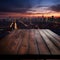 Skyline twilight Blurred night sky, wooden table in the midst of urbanity