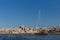 Skyline of Valletta, Malta under blue sky, with dome of Basilica of Our Lady of Mount Carmel and tower of St Paul`s Pro-Cathedral