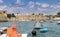 Skyline view of the ancient city Akko. The photo was shot between the boats towards the wall, harbor, and beach.