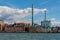 Skyline view of a blue power plant among residential buildings in the city of Gothenburg Sweden.