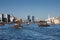 Skyline view of Dubai Creek with traditional boat