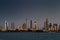 A skyline view of Dubai, UAE at Sunset as seen from Jumeirah Beach