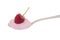 Skyr, healthy Icelandic food, raspberry flavour on spoon, isolated on white. Similar to yogurt, it is a kind of cheese