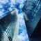 Skyscraper business buildings in blue sky with clouds.