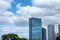 Skyscraper reflection cloud in downtown and airplane flying on b