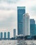 Skyscrapers, bridge and boats on river in Bangkok