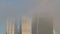 Skyscrapers in City of London in mist in the business area showing Walkie Talkie building and other