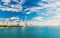 Skyscrapers of downtown district of miami usa on cloudy sky. Seascape with bridge and buildings on sea horizon