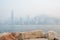 The skyscrapers of Hong Kong\'s financial district and Victoria Peak obscured by air pollution