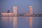 Skyscrapers of the Nesselande residential district of Rotterdam reflecting in Zevenhuizerplas by sunset in the Netherlands seen at