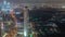 Skyscrapers and other buildings near the Dubai World Trade center district in Dubai aerial night timelapse