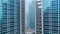 Skyscrapers reflecting in other skyscrapers with glass fasade