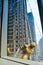 Skyscrapers window Cleaner wearing a yellow suit washing a window in Doha, Qatar