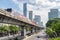 Skytrain passing above Sathon Road, Bangkok, Thailand