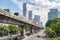 Skytrain passing above Sathon Road in Bangkok, Thailand