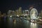 Skyviews Miami Observation Wheel at Bayside Marketplace with reflections in Biscayne Bay water and high illuminated