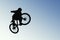 Skyward Bound: A Cyclist in Silhouette