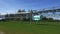 Skyway unitruck drives along overpass railway on sunny day