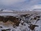 SkÃ³gÃ¡ river with waterfall Steinbogafoss in a rocky canyon near FimmvÃ¶rÃ°uhÃ¡ls trail in winter.