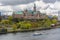 A SL GURLY ferry, public transport of the city of Stockholm, passes along Danvikshem, grand old building housing retirement home