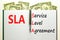 SLA service level agreement symbol. Concept words SLA service level agreement on beautiful white note. Beautiful dollar bills