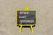 SLA service level agreement symbol. Concept words SLA service level agreement on beautiful yellow blackboard. Beautiful sand