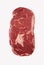Slab of thick rib eye beef steak isolated on white
