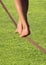 Slackline feet over grass