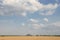 Slagheap in western Ukraine with wheat field