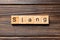 Slang word written on wood block. slang text on table, concept