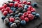 Slate plate with delicious frozen berries, closeup