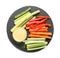Slate plate with dip sauce, celery and other vegetable sticks isolated on white, top view
