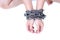 Slave woman hands tied up with steel chain on white background, Human rights violations, International Women`s Day