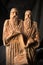 Slavonic educators Cyril and Methodius clay statues close up image. Old men hold scroll of holy scriptures. Russian alphabet make