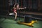 Sled push woman pushing weights workout exercise