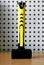 Sledge hammer with rubberized yellow handle, front view, vertica