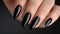 Sleek Black Manicure on Female Hands Closeup