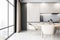 Sleek kitchen corner with panoramic window and textured white wall, urban living.