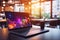 Sleek laptop with blurred bokeh effect on desk, vibrant abstract background with colorful lights